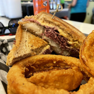 Sloppy Seconds Bar and Grill Reuben with Onion Rings